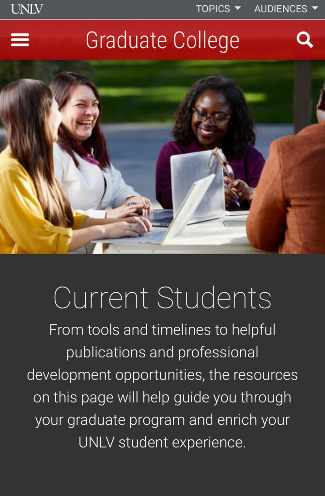 Students working on laptops and laughing with one another