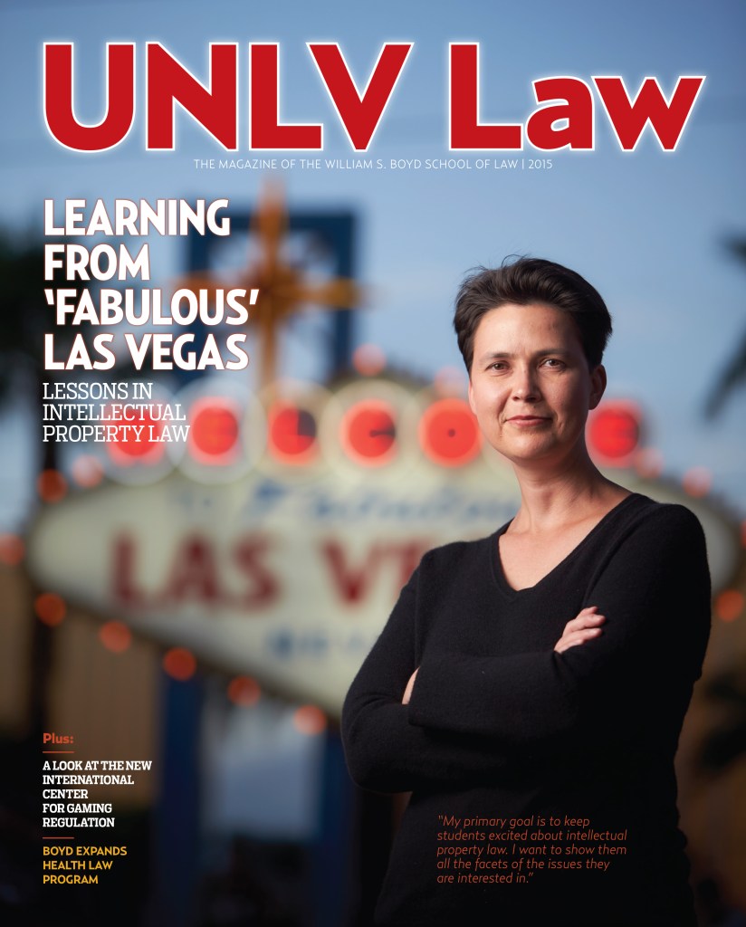 UNLV Law magazine cover featuring Professor Marketa Trimble standing in front of the Welcome to Las Vegas sign